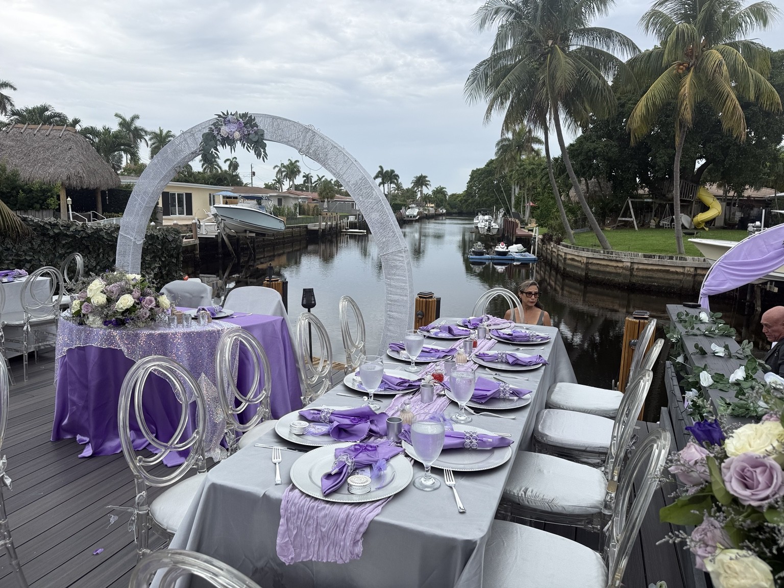 Lavender table settings beside the water