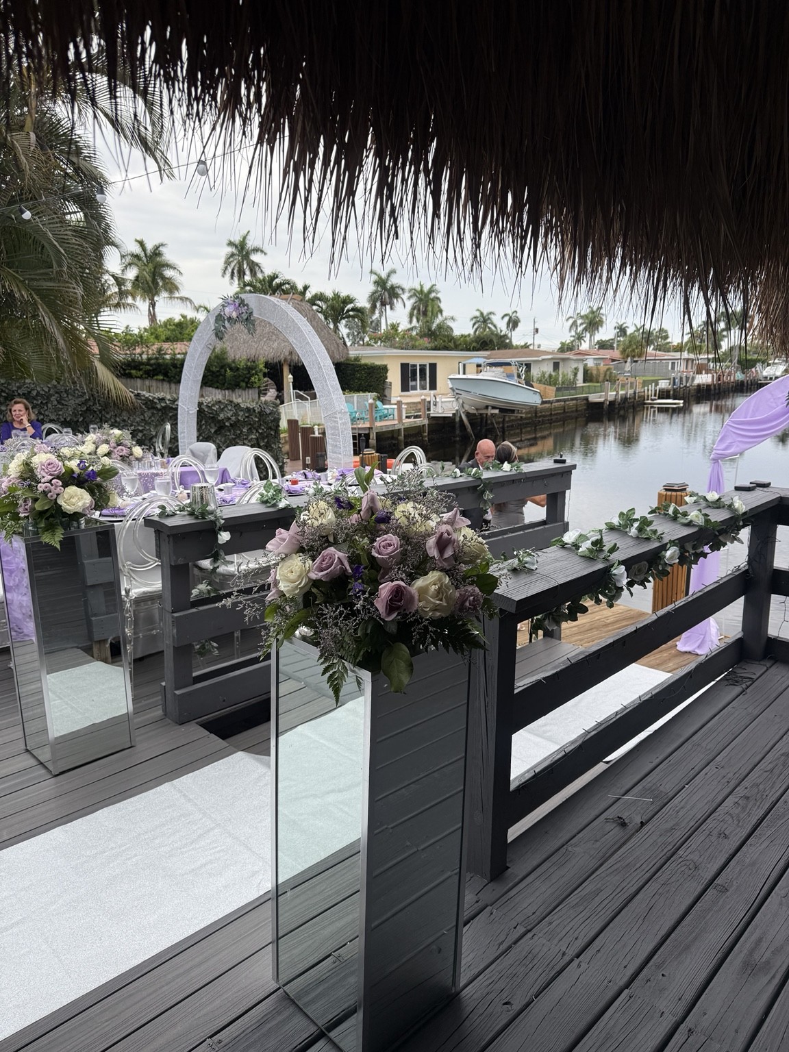 A waterfront wedding beneath the palms